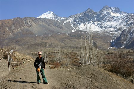 simsearch:625-01752943,k - Young woman standing in front of mountains, Muktinath, Annapurna Range, Himalayas, Nepal Stock Photo - Premium Royalty-Free, Code: 625-01752940