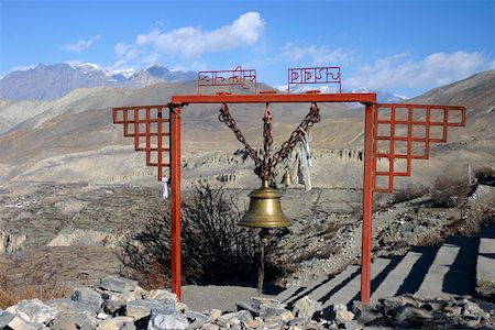 Close-up of a bell hanging from a metallic structure, Muktinath, Annapurna Range, Himalayas, Nepal Stock Photo - Premium Royalty-Free, Code: 625-01752958