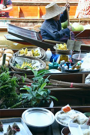 products selling in the floating market thailand - Side profile of a woman rowing boat in the floating market, Thailand Stock Photo - Premium Royalty-Free, Code: 625-01753018