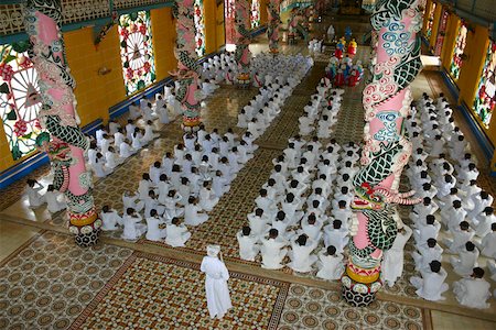 simsearch:841-08059489,k - High angle view of a group of people praying in a monastery, Cao Dai Monastery, Tay Ninh, Vietnam Stock Photo - Premium Royalty-Free, Code: 625-01753068