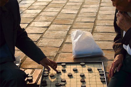 polythene - Two men playing a board game, Hanoi, Vietnam Stock Photo - Premium Royalty-Free, Code: 625-01753073