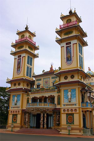 Low angle view of a monastery, Cao Dai Monastery, Tay Ninh, Vietnam Stock Photo - Premium Royalty-Free, Code: 625-01753096