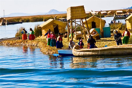 Group of people at a lakeside, Lake Titicaca, Uros Floating Islands, Puno, Peru Stock Photo - Premium Royalty-Free, Code: 625-01753173