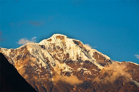 simsearch:625-01753433,k - Low angle view of a snowcovered mountain, Salcantay, Choquequirao Peru Foto de stock - Sin royalties Premium, Código: 625-01753450