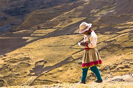 peru traditional dress pictures - Side profile of a girl walking on a hill, Peru Stock Photo - Premium Royalty-Free, Code: 625-01753521