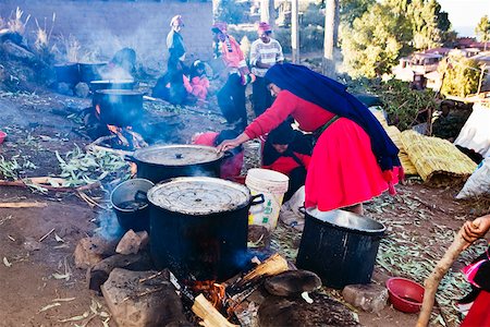 Side profile of a mature woman preparing food, Taquile Island, Puno, Peru Stock Photo - Premium Royalty-Free, Code: 625-01753539