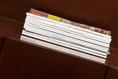 Close-up of magazines on a table Stock Photo - Premium Royalty-Free, Code: 625-02265798