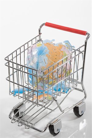 puzzle concept not person - Close-up of a broken globe in a shopping cart Stock Photo - Premium Royalty-Free, Code: 625-02265939