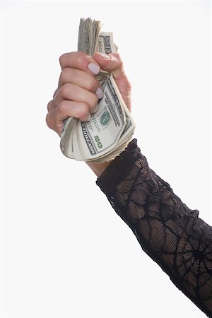 Close-up of a person's hand holding US dollar bills Fotografie stock - Premium Royalty-Free, Codice: 625-02265996