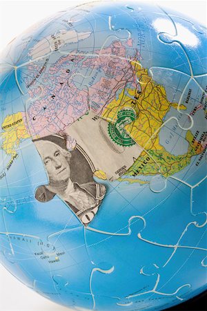 Close-up of a globe made of jigsaw puzzles Stock Photo - Premium Royalty-Free, Code: 625-02266038