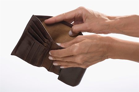 downturn - Close-up of a businessman's hands showing his empty wallet Stock Photo - Premium Royalty-Free, Code: 625-02266107