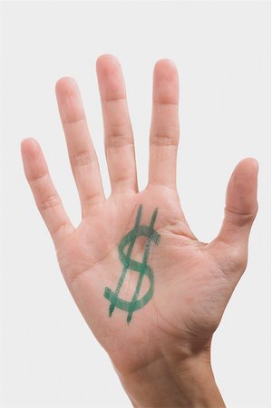 symbol finger - Dollar sign on a person's palm Stock Photo - Premium Royalty-Free, Code: 625-02266103