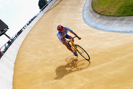Man cycling on a sports track Stock Photo - Premium Royalty-Free, Code: 625-02266313