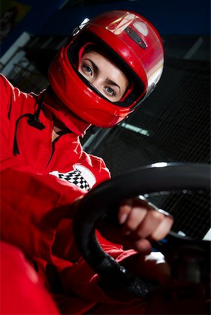 sports car and person - Portrait of a female go-cart racer sitting in a sports car Stock Photo - Premium Royalty-Free, Code: 625-02266412