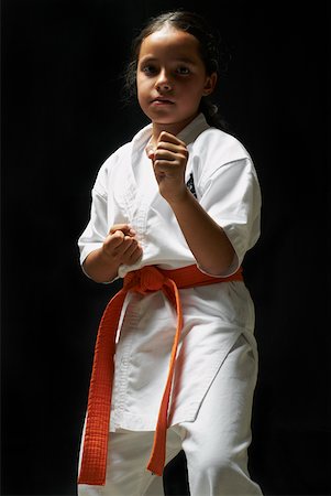 Portrait of a girl practicing karate Foto de stock - Sin royalties Premium, Código: 625-02266413