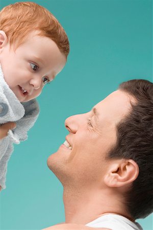 simsearch:625-02267467,k - Close-up of a mid adult man playing with his son Stock Photo - Premium Royalty-Free, Code: 625-02266501