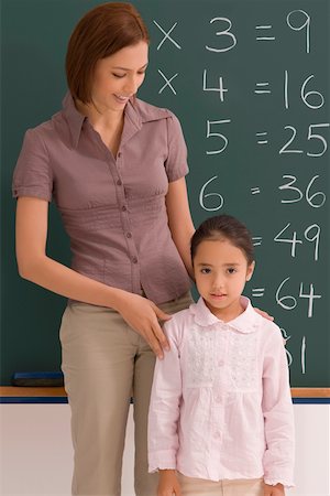 simsearch:625-01250891,k - Female teacher with her student in a classroom Fotografie stock - Premium Royalty-Free, Codice: 625-02266532