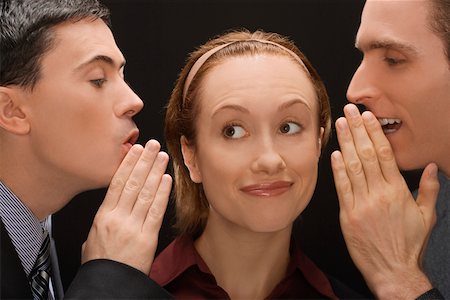 simsearch:625-02931286,k - Two businessmen whispering to a businesswoman Stock Photo - Premium Royalty-Free, Code: 625-02266593