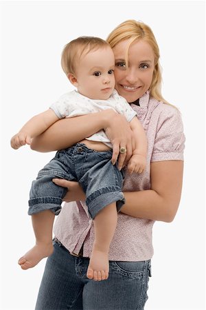 Portrait of a mid adult woman smiling with her son Stock Photo - Premium Royalty-Free, Code: 625-02266684