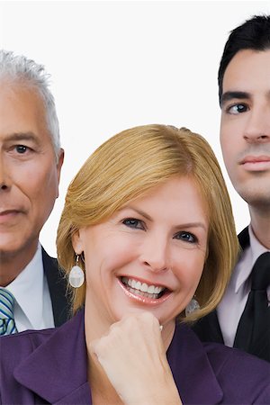 portraits old headshot caucasian business man white background - Portrait of a businesswoman smiling with two businessmen beside her Stock Photo - Premium Royalty-Free, Code: 625-02266989