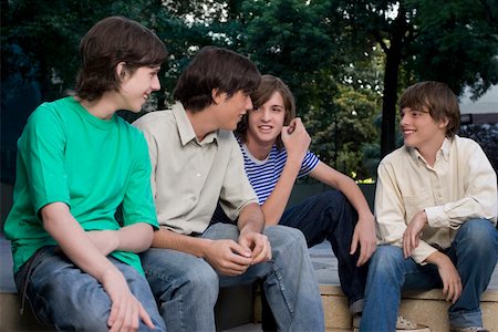 simsearch:625-02930319,k - Four friends sitting together Stock Photo - Premium Royalty-Free, Code: 625-02267125