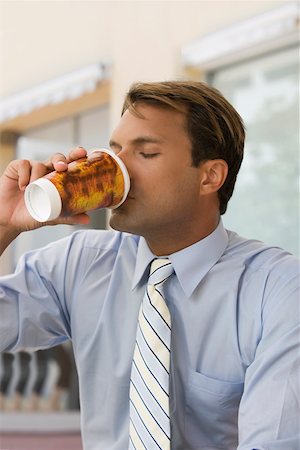 executive man hot - Close-up of a businessman drinking coffee Stock Photo - Premium Royalty-Free, Code: 625-02267142