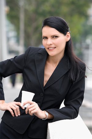 simsearch:625-02932995,k - Portrait of a businesswoman holding a disposable cup and smiling Stock Photo - Premium Royalty-Free, Code: 625-02267154