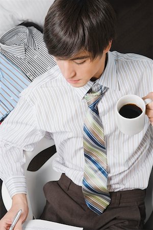 Businessman holding a cup of coffee Stock Photo - Premium Royalty-Free, Code: 625-02267178