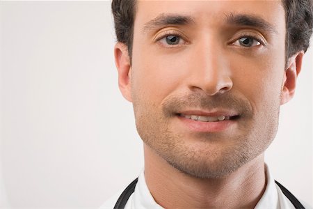 simsearch:625-02933219,k - Close-up of a male doctor smiling Foto de stock - Sin royalties Premium, Código: 625-02267242