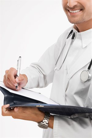 simsearch:625-02929220,k - Close-up of a male doctor writing on a file Stock Photo - Premium Royalty-Free, Code: 625-02267291