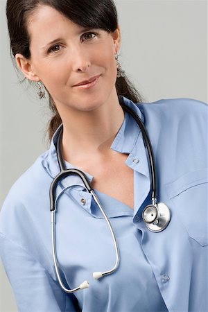 simsearch:625-02929220,k - Portrait of a female doctor smiling Stock Photo - Premium Royalty-Free, Code: 625-02267303