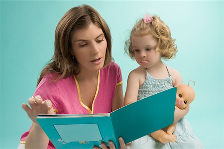 Close-up of a mid adult woman teaching her daughter Stock Photo - Premium Royalty-Free, Code: 625-02267343