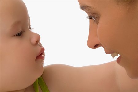 simsearch:625-02267467,k - Close-up of a mid adult woman looking at her daughter and smiling Stock Photo - Premium Royalty-Free, Code: 625-02267354