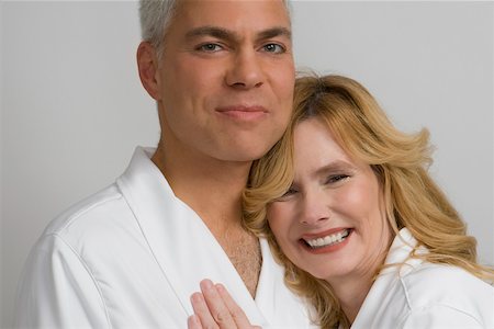 Portrait of a mature couple embracing each other and smiling Stock Photo - Premium Royalty-Free, Code: 625-02267405