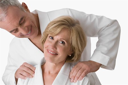 Close-up of a mature woman smiling with a senior man looking at her face Stock Photo - Premium Royalty-Free, Code: 625-02267414