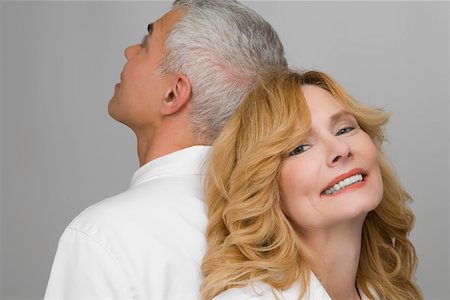 simsearch:625-02928309,k - Close-up of a mature couple back to back Stock Photo - Premium Royalty-Free, Code: 625-02267416