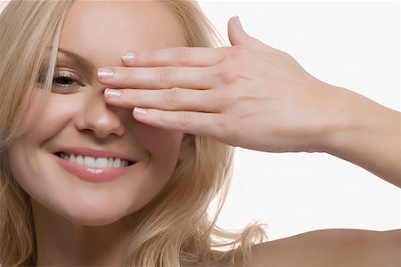 female hands covering eyes - Portrait of a young woman smiling Stock Photo - Premium Royalty-Free, Code: 625-02267559