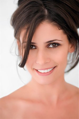 simsearch:625-02267530,k - Portrait of a young woman smiling Stock Photo - Premium Royalty-Free, Code: 625-02267596