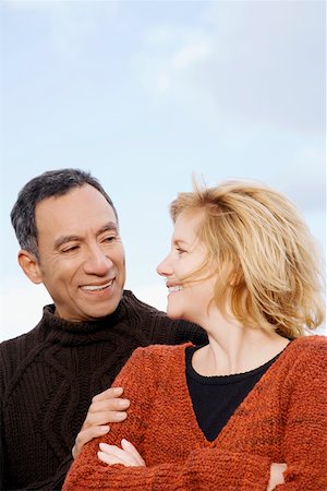 senior latino couple happy - Close-up of a mature couple looking at each other and smiling Stock Photo - Premium Royalty-Free, Code: 625-02267627