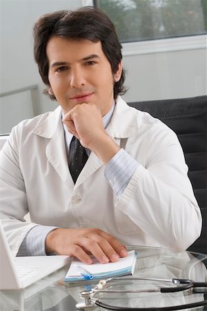 Portrait of a male doctor sitting in a clinic Stock Photo - Premium Royalty-Free, Code: 625-02267660