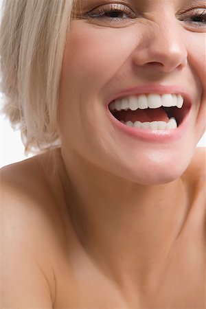 simsearch:625-02267557,k - Close-up of a young woman laughing Stock Photo - Premium Royalty-Free, Code: 625-02267690