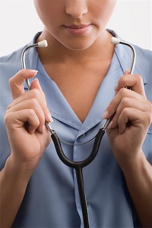 simsearch:625-02929220,k - Female doctor holding a stethoscope Stock Photo - Premium Royalty-Free, Code: 625-02267806