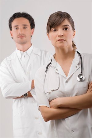 simsearch:625-02929220,k - Portrait of a female and a male doctor standing with their arms crossed Stock Photo - Premium Royalty-Free, Code: 625-02267816