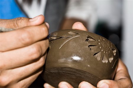 Close-up of a person's hand making pottery, San Bartolo Coyotepec, Oaxaca State, Mexico Stock Photo - Premium Royalty-Free, Code: 625-02267973