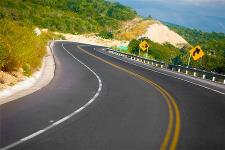 sign post arrows - Road passing through mountains, San Luis Potosi, Mexico Stock Photo - Premium Royalty-Free, Code: 625-02268069