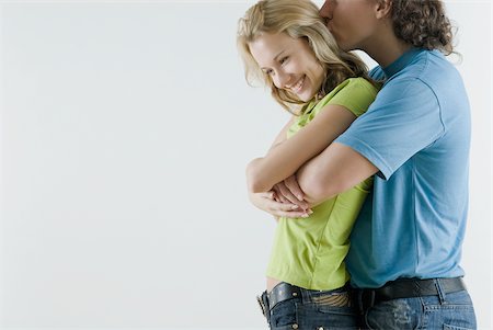 simsearch:625-02930658,k - Side profile of a young couple romancing Stock Photo - Premium Royalty-Free, Code: 625-02926829