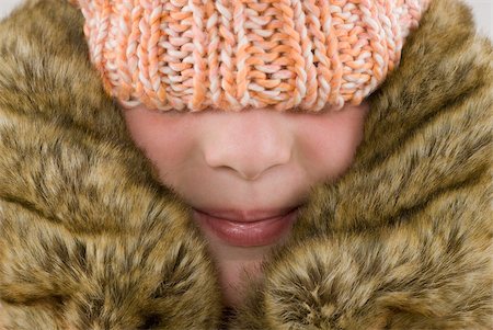 Close-up of a girl wearing a winter coat Stock Photo - Premium Royalty-Free, Code: 625-02926820