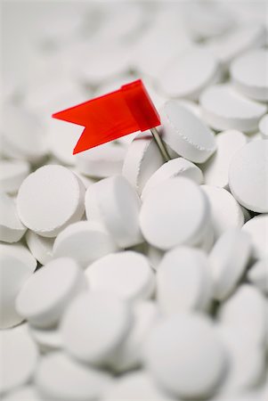 Close-up of a flag on the heap of pills Foto de stock - Royalty Free Premium, Número: 625-02926988