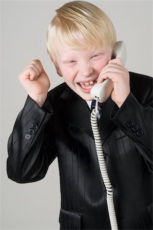 simsearch:625-02930383,k - Close-up of a boy talking on the telephone Foto de stock - Sin royalties Premium, Código: 625-02927364