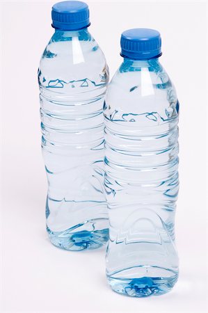 plastic bottles water - Close-up of two water bottles Stock Photo - Premium Royalty-Free, Code: 625-02927420